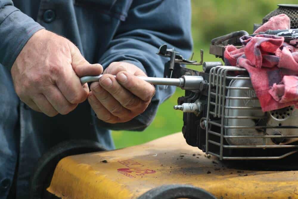 repairing broken used lawn mower